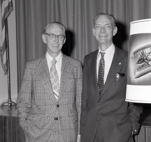 Two men standing.