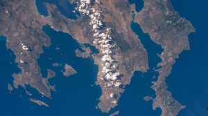 A partly cloudy Athens, Greece (center), on the Saronic Gulf, is pictured from the International Space Station as it orbited 259 miles above the Aegean Sea.
