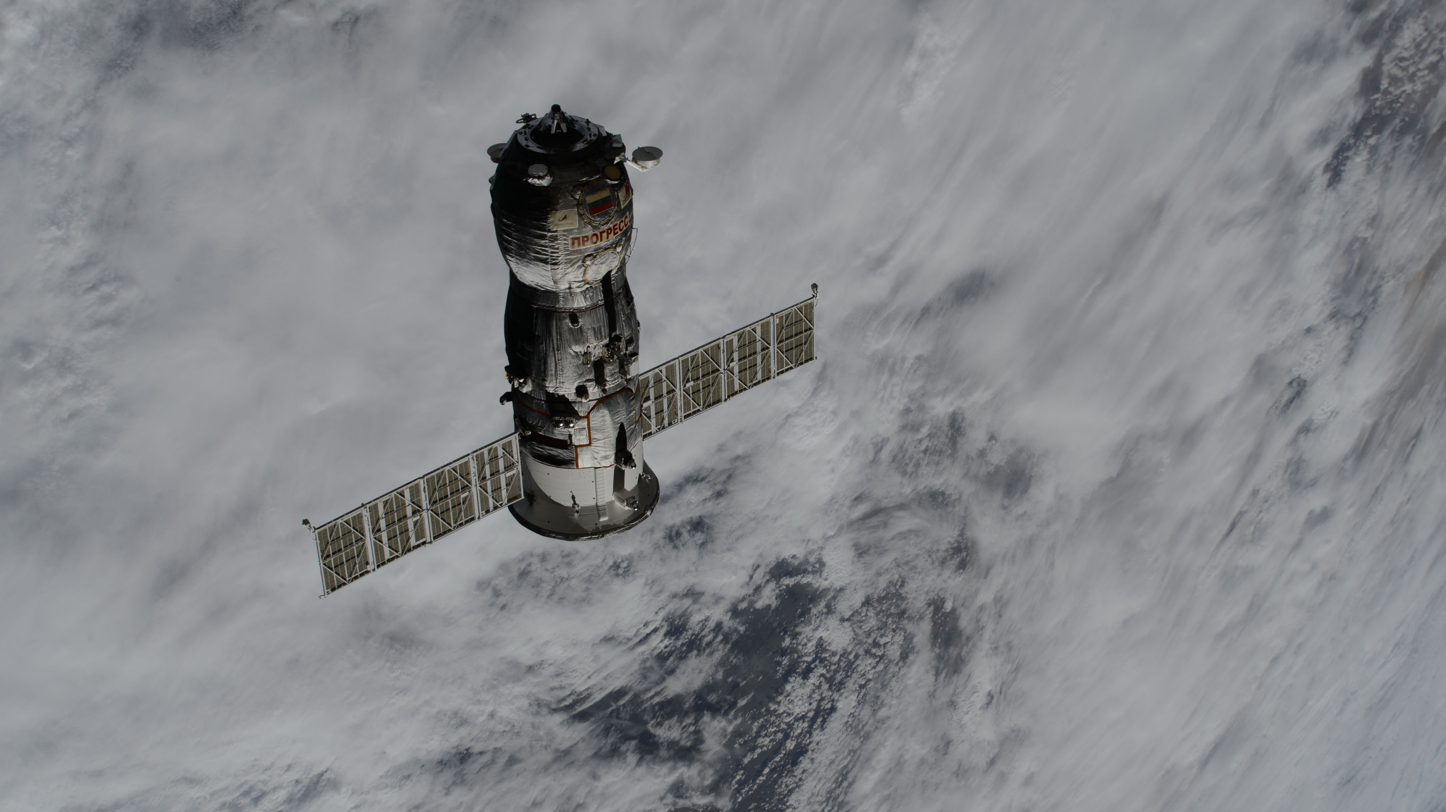 The uncrewed Roscosmos Progress 86 cargo craft, packed with trash and obsolete gear, departs the vicinity of the International Space Station after undocking from the Poisk module ending a six-month cargo mission.