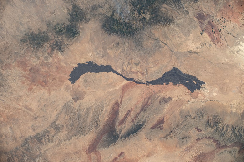 The Carrizozo Malpais, an ancient lava flow in New Mexico, is pictured from the International Space Station as it orbited 261 miles above the Land of Enchantment.