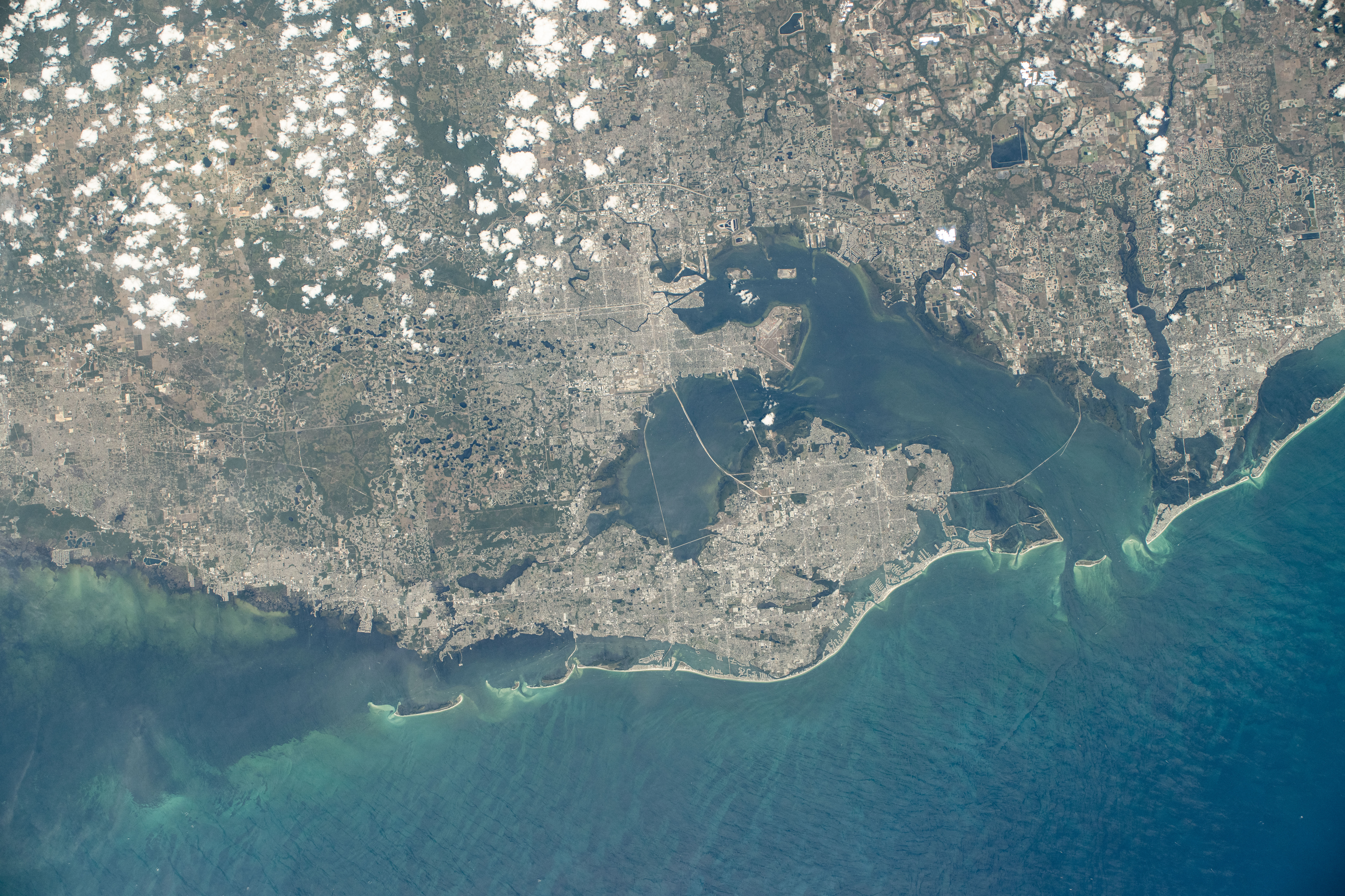Florida's cities of Tampa, St. Petersburg, Clearwater, and surrounding suburbs on Tampa Bay are pictured from the International Space Station as it orbited 261 miles above the Gulf of Mexico.
