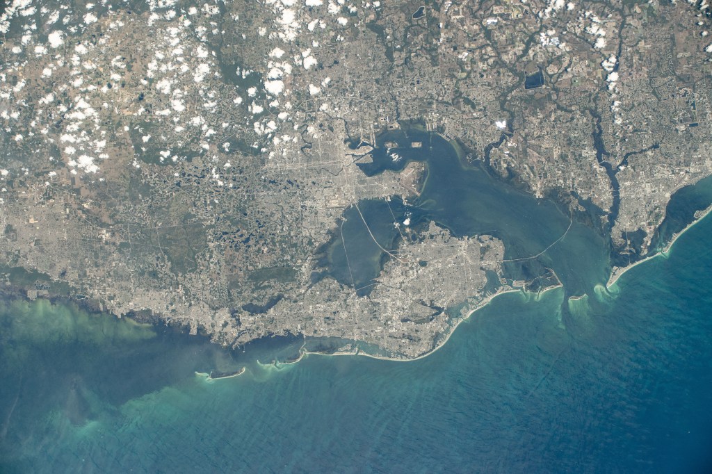 Florida's cities of Tampa, St. Petersburg, Clearwater, and surrounding suburbs on Tampa Bay are pictured from the International Space Station as it orbited 261 miles above the Gulf of Mexico.