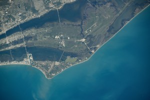 NASA's John F. Kennedy Space Center, the center's Launch Pads 39A and 39B, and the Cape Canaveral Space Force Station on Florida's Atlantic coast are pictured from the International Space Station as it orbited 261 miles above.