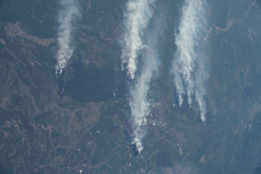 Wildfires in eastern Russia are pictured from the International Space Station as it orbited 264 miles above the China-Russia border.