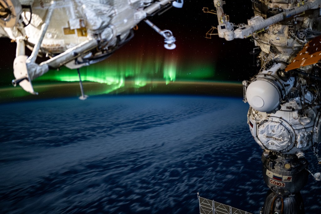 An aurora swirls above the Indian Ocean in this photograph from the International Space Station as it orbited 266 miles above and due south of Australia's island state of Tasmania.