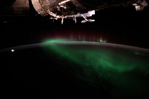 The aurora australis, also known as the Southern Lights, shimmers over the Indian Ocean in between Australia and Antarctica in this photograph from the International Space Station as it orbited 266 miles above.