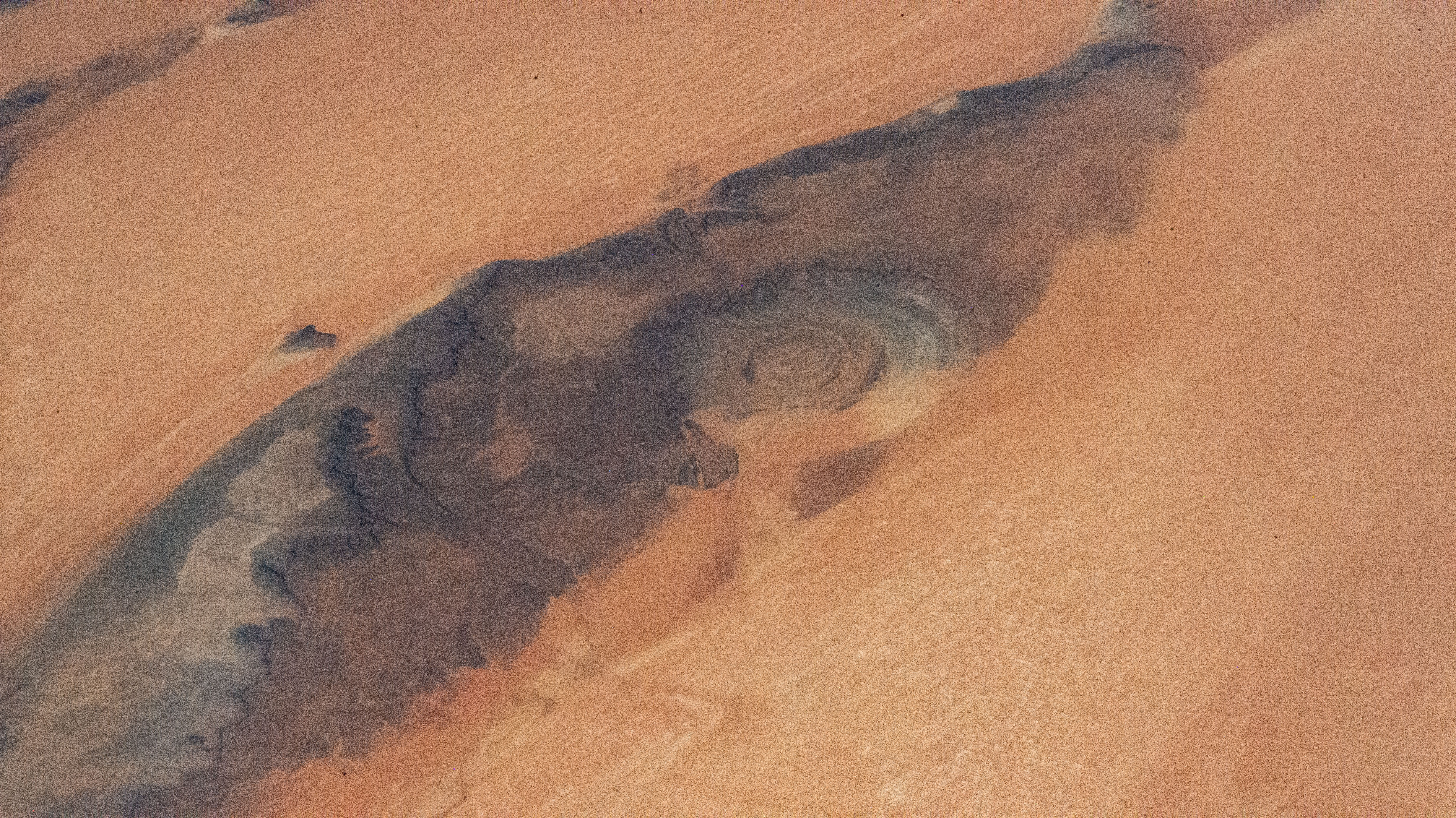 The Rihat Structure, also known as the Eye of the Sahara, is a deeply eroded geologic dome in the African nation of Mauritania pictured from the International Space Station as it orbited 258 miles above.