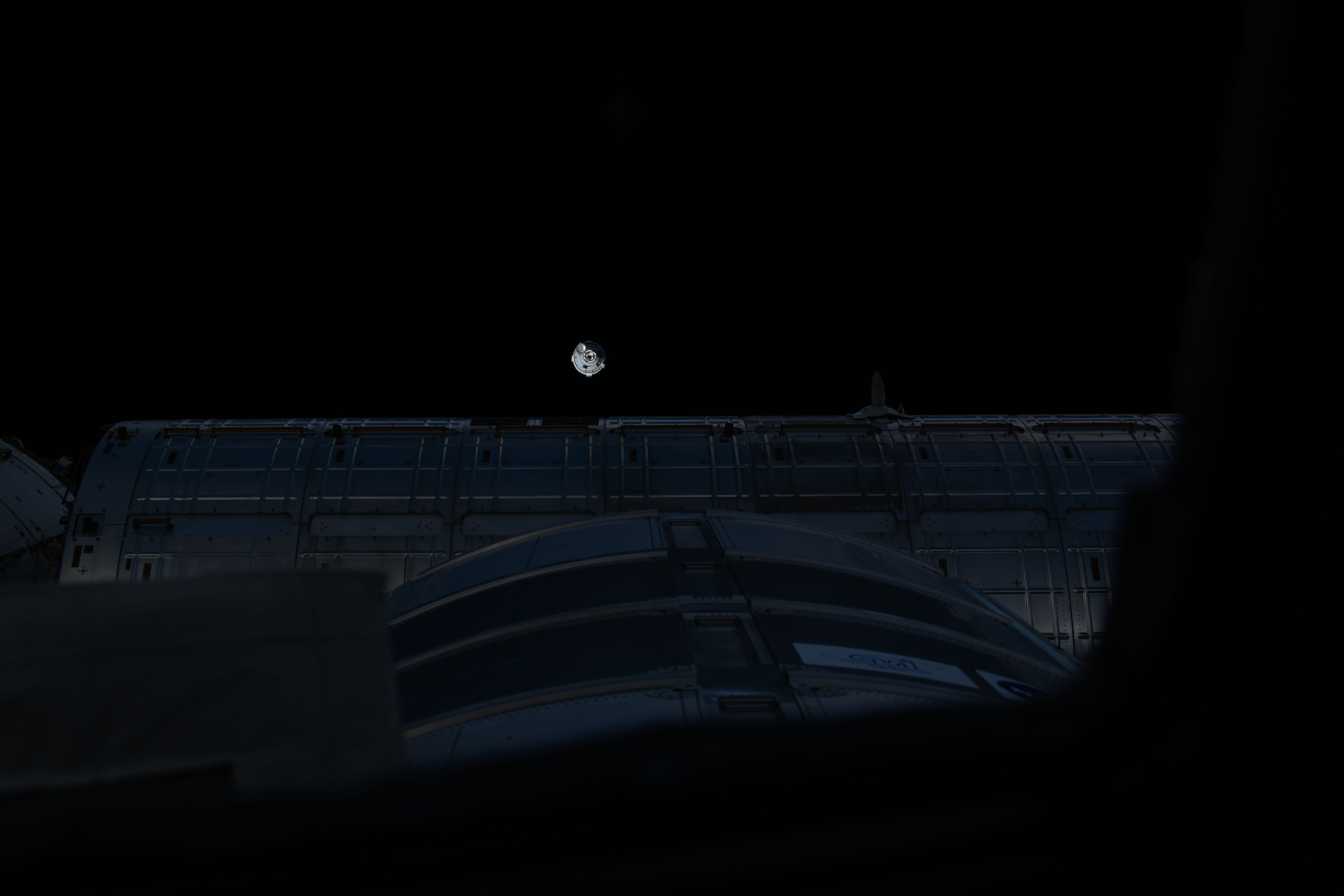 This view from a window on the cupola overlooks the Kibo laboratory module as Boeing's Starliner spacecraft carrying NASA astronauts Butch Wilmore and Suni WIlliams approaches the International Space Station.