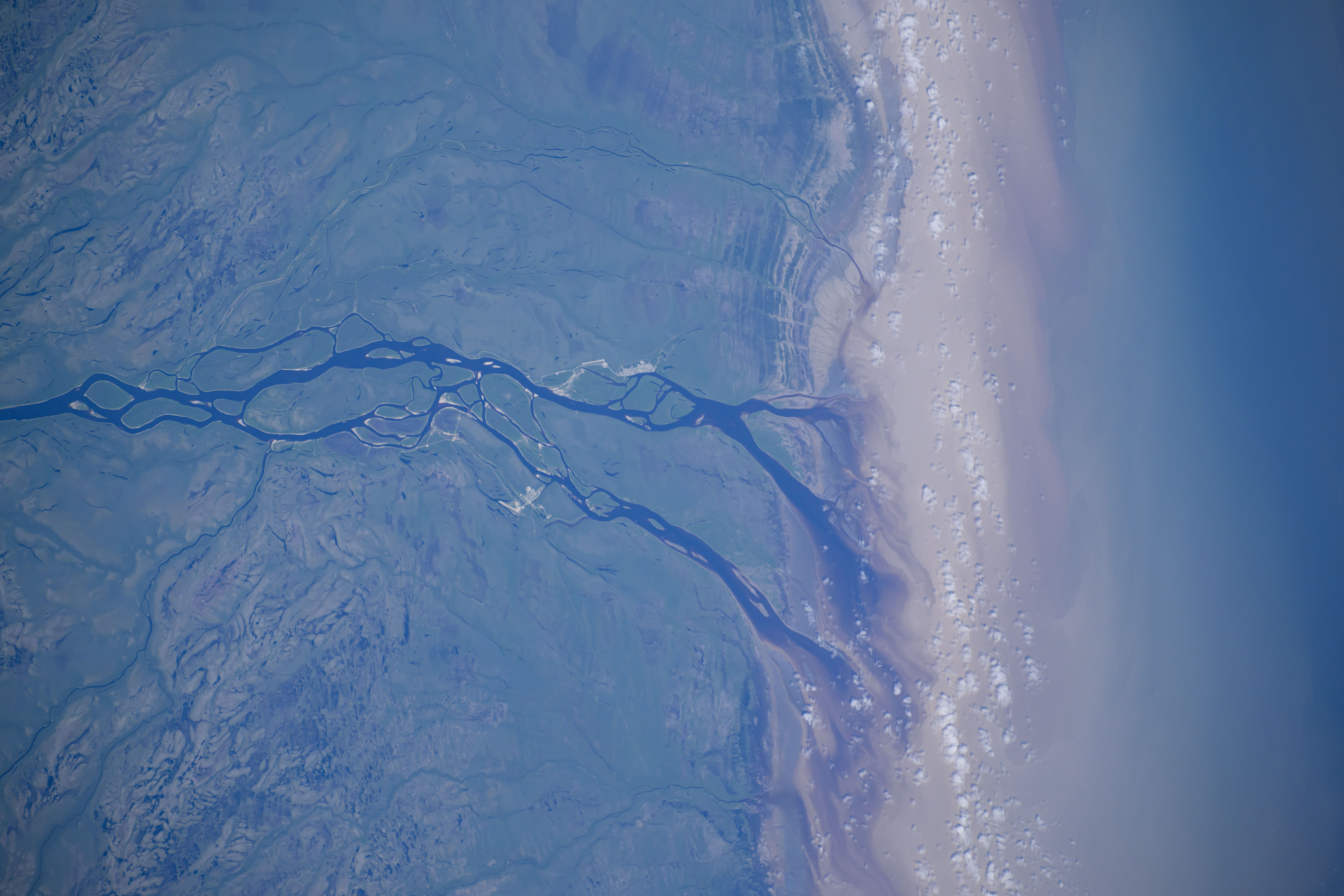 The Albany River flows into James Bay in this photograph from the International Space Station as it orbited 265 miles above Ontario, Canada.