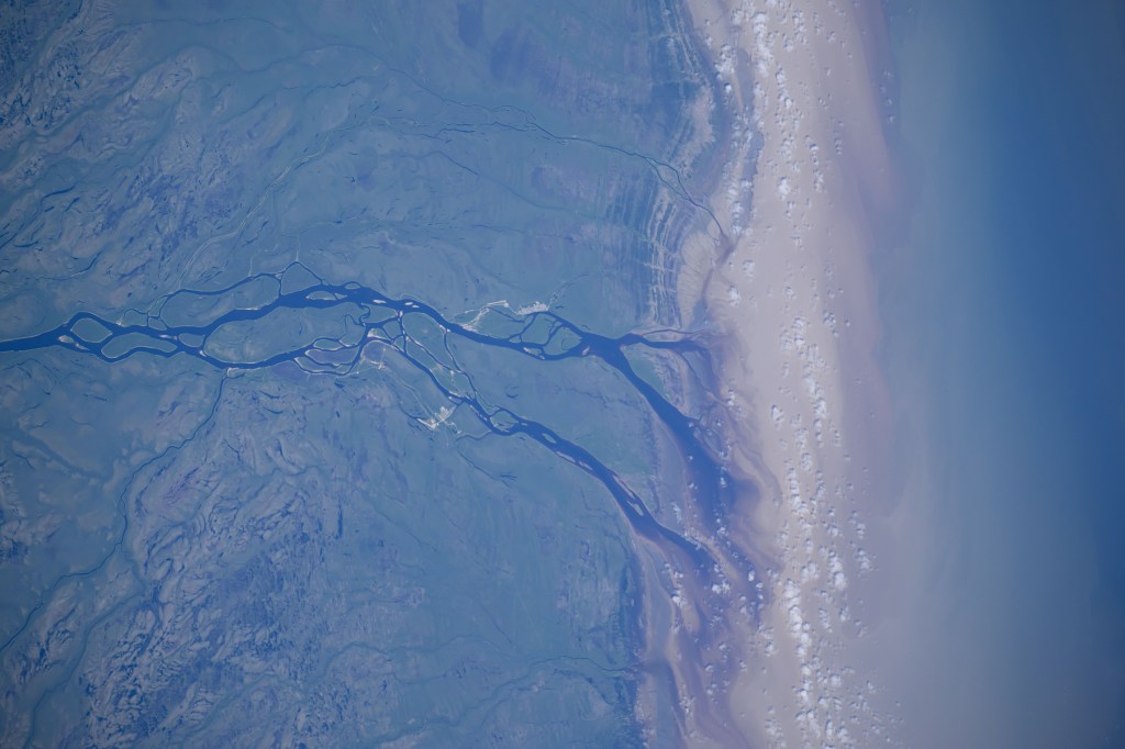 The Albany River flows into James Bay in this photograph from the International Space Station as it orbited 265 miles above Ontario, Canada.
