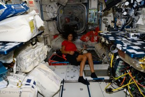NASA astronaut and Boeing Crew Flight Test Pilot Suni Williams is pictured in front of the Harmony module's vestibule that leads to the forward port where Boeing's Starliner spacecraft is docked to the International Space Station.