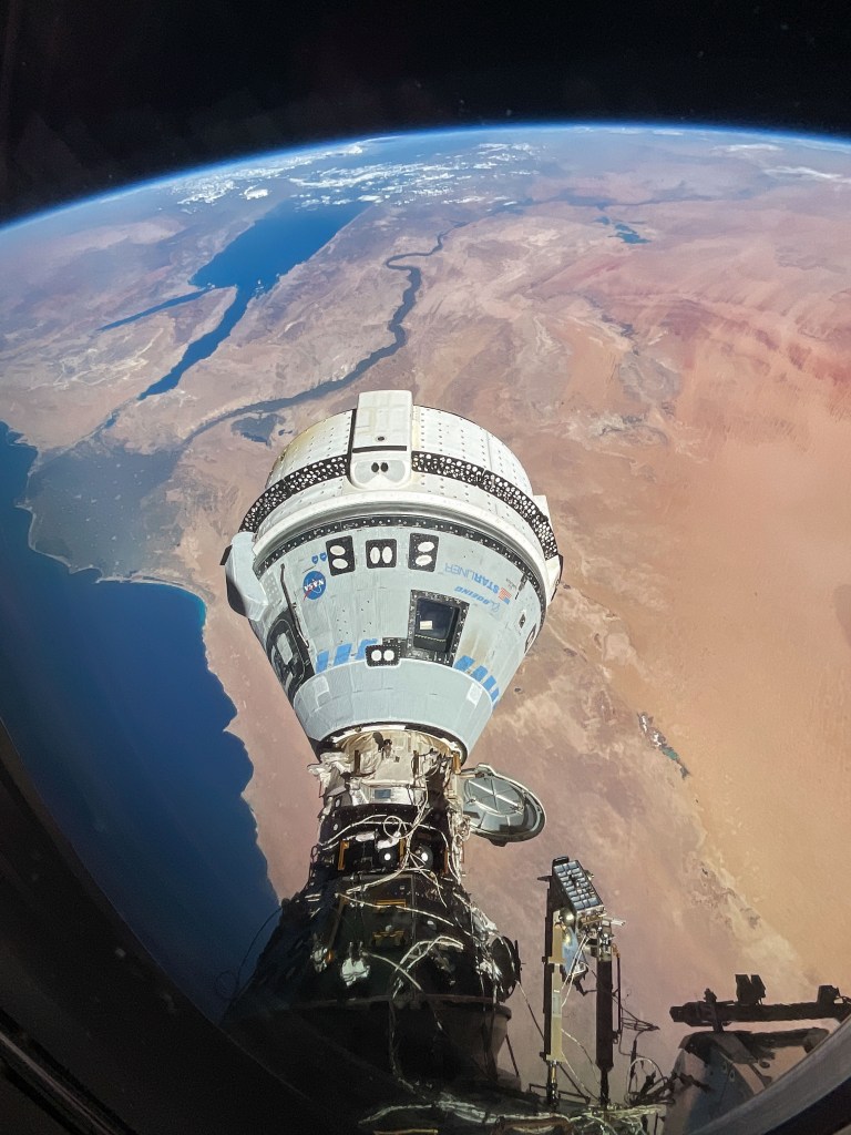 The Starliner spacecraft on NASA's Boeing Crew Flight Test is pictured docked to the Harmony module's forward port as the International Space Station orbited 262 miles above Egypt's Mediterranean coast.