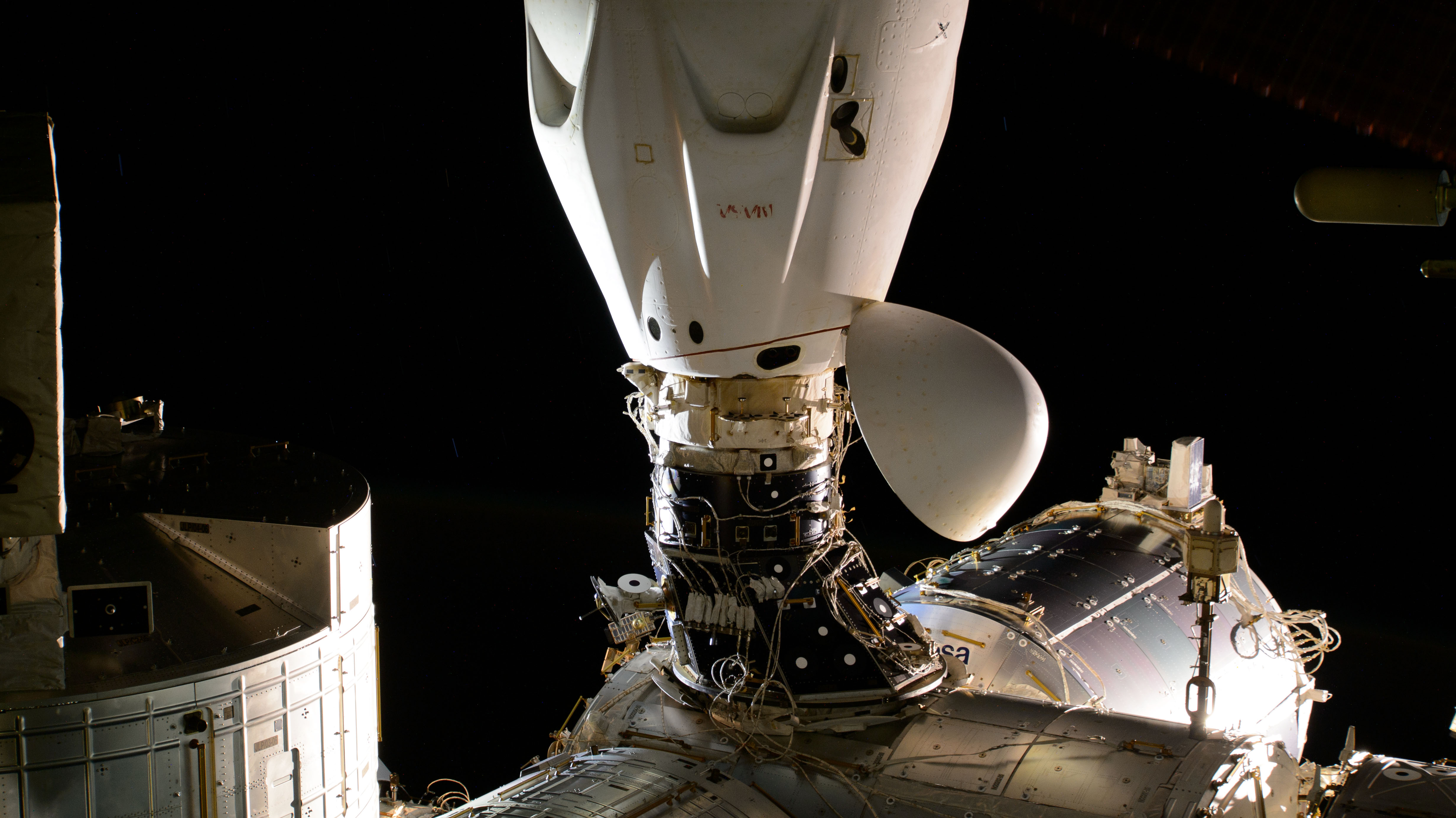 The SpaceX Dragon Endeavour spacecraft is pictured docked to the space-facing port on the International Space Station's Harmony module.