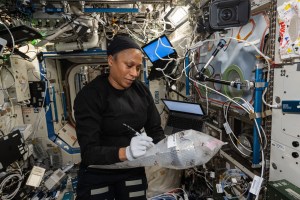 NASA astronaut and Expedition 71 Flight Engineer Jeanette Epps documents research hardware while working in the International Space Station's Destiny laboratory module.