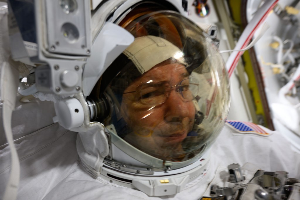 NASA astronaut and Expedition 71 Flight Engineer Mike Barratt is pictured in his spacesuit prior to the start of a science and maintenance spacewalk that ended early on June 24, 2024, after fellow astronaut and flight engineer Tracy C. Dyson's (out of frame) spacesuit experienced a water leak in the service and cooling umbilical unit.