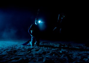 Divers at the Neutral Buoyancy Laboratory (NBL) in Houston are setting the stage for future Moonwalk training by simulating lunar lighting conditions. At the Lunar South Pole, the Sun will remain no more than a few degrees above the horizon, resulting in extremely long and dark shadows. To prepare astronauts for these challenging lighting conditions, the team at the NBL has begun preliminary evaluations of lunar lighting solutions at the bottom of the 40-foot deep pool. This testing and evaluation involved turning off all the lights in the facility, installing black curtains on the pool walls to minimize reflections, and using a powerful underwater cinematic lamp, to get the conditions just right ahead of upcoming training for astronauts. Credit: Lauren Maples