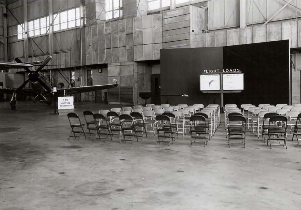 Empty chairs in front of exhibit.