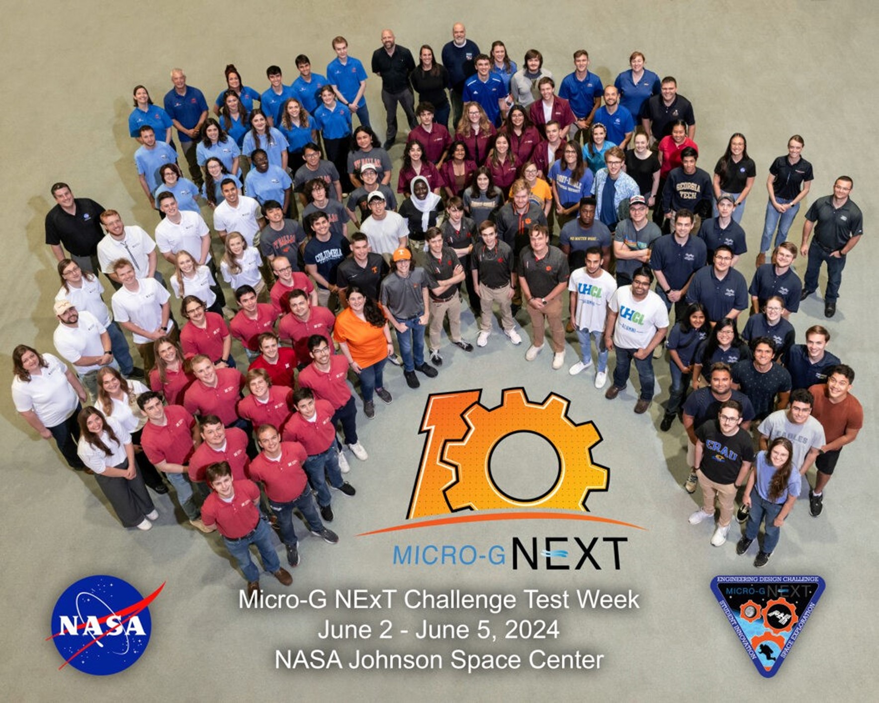 Students pose at NASA Johnson's neutral Buoyancy Laboratory with the 10-year anniversary logo of Micro0g NExT in front of them.