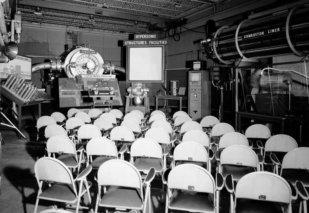 Empty chairs in front of exhibit.