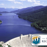 Picture of a water reservoir held by a dam.