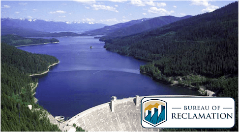 Picture of a water reservoir held by a dam.