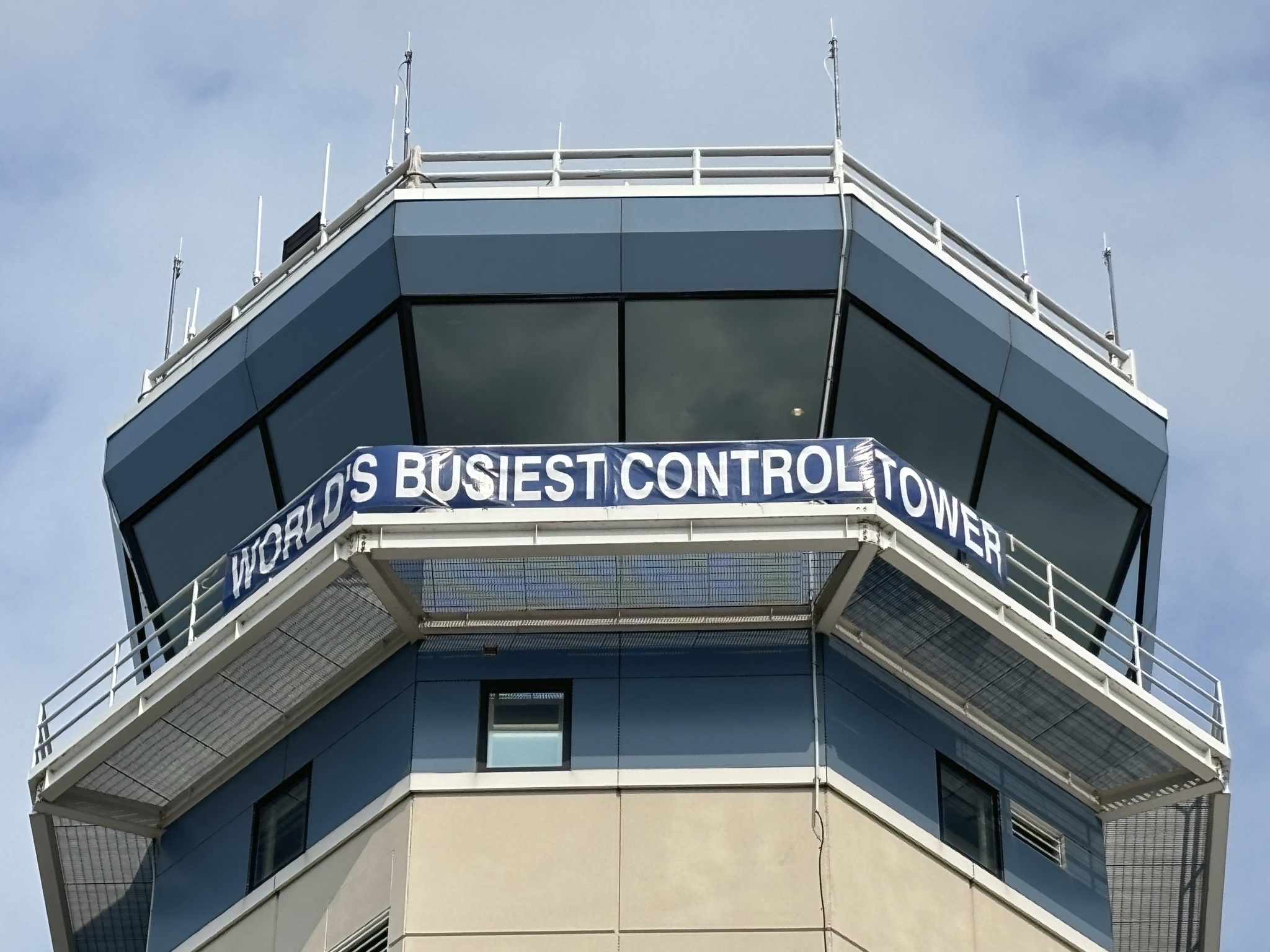 A close up of the top of an air traffic control tower.