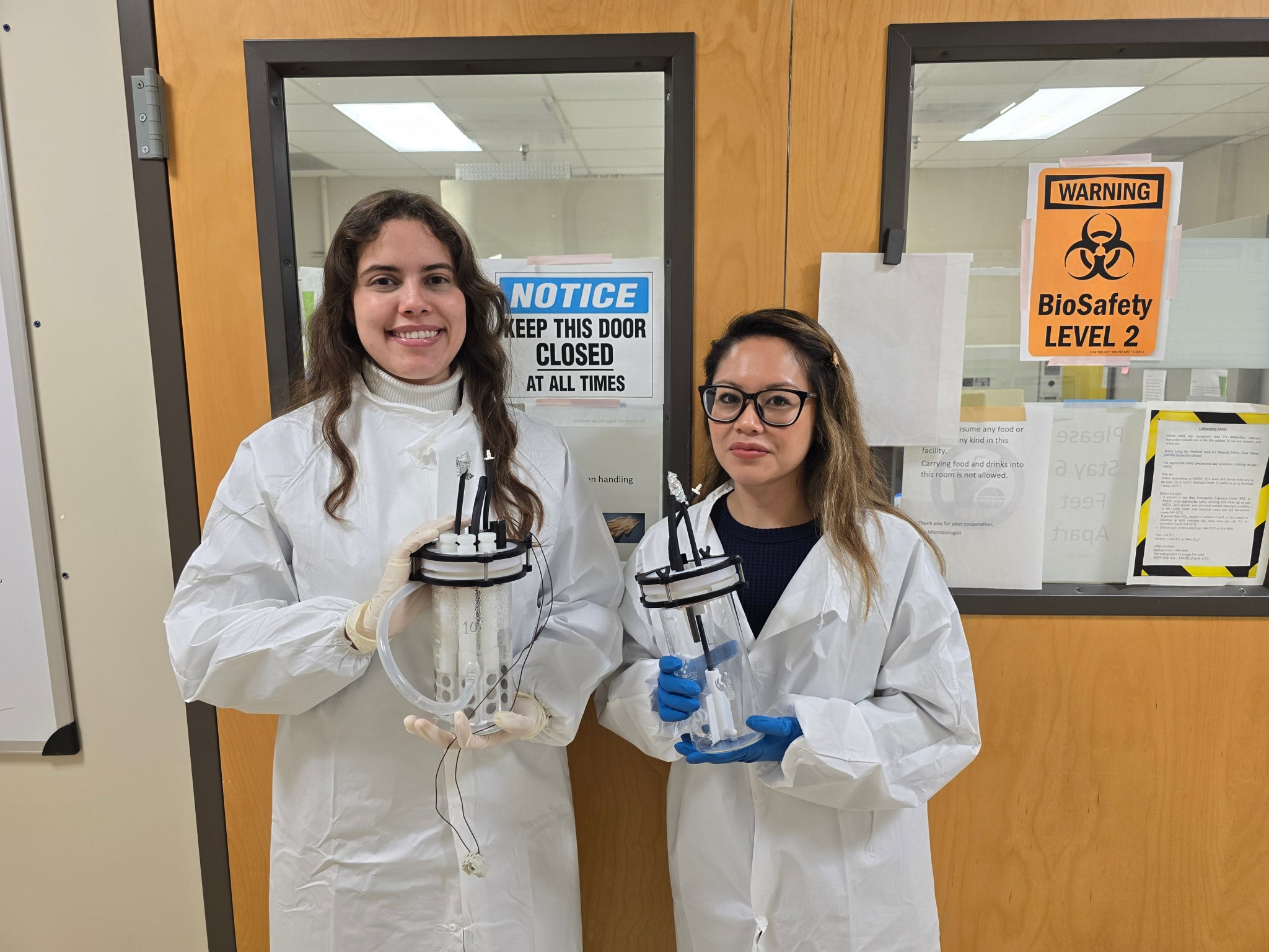 NASA Pathways intern Liezel Koellner, right, and her mentor Yo-Ann Velez-Justiniano, a microbiologist at NASA’s Marshall Space Flight Center, prepare compact bioreactors to be installed in the Marshall biofilm mitigation test stand, which is helping researchers study ways to curtail bacterial and fungal biofilm growth in water reclamation systems such as the one on the International Space Station.