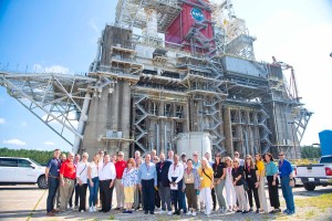 Members of the Aerospace States Association stand at the Thad Cochran Test Stand