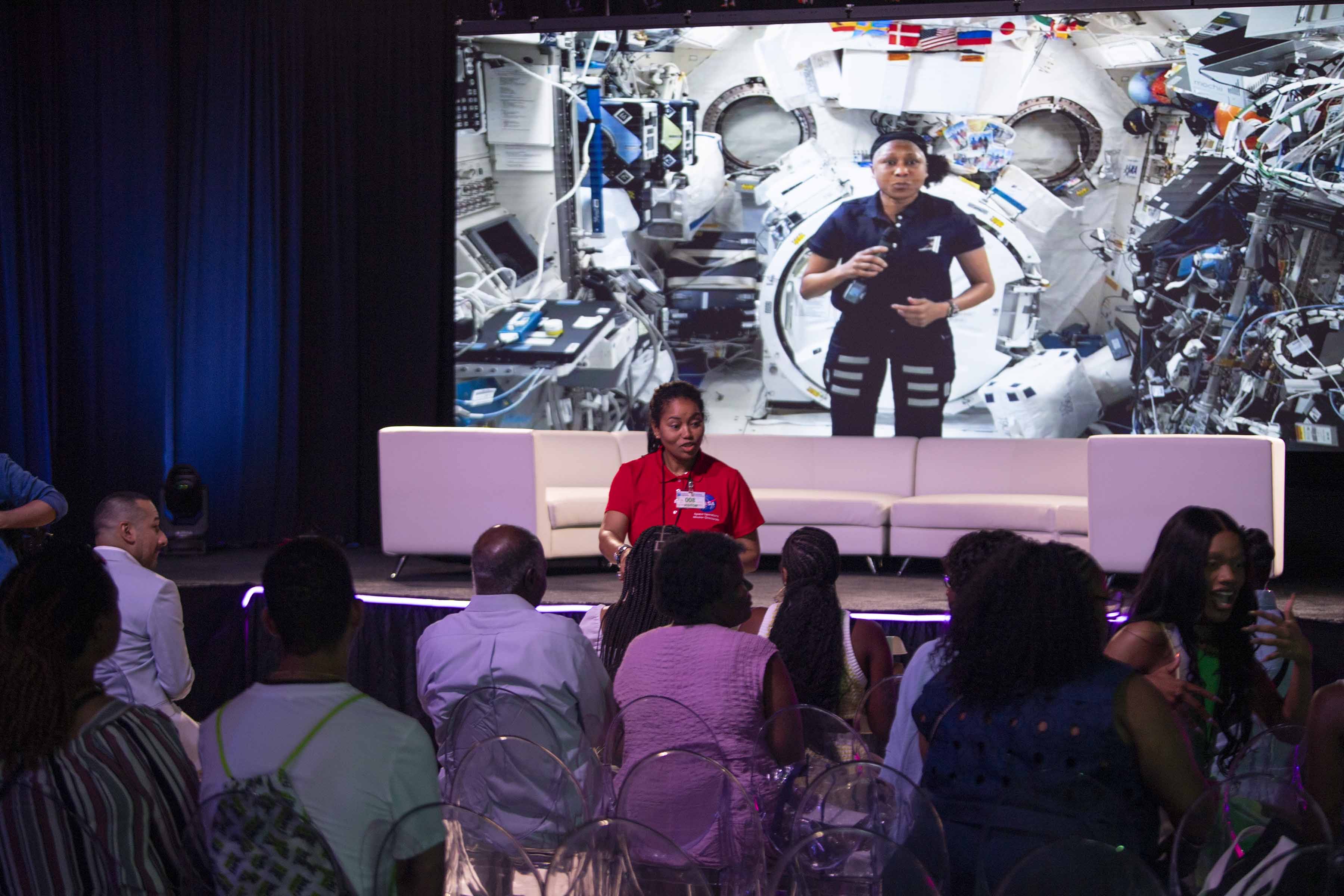 NASA program specialist Miyoshi Collins talks with an annual ESSENCE Fest audience