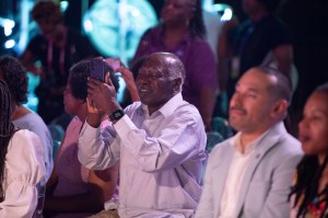 An audience member uses his cell phone to capture the Take Up Space (Literally) panel conversation at Essence Fest