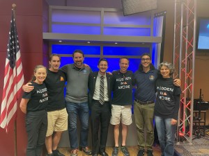 The Houston We Have a Podcast team and CHAPEA crew pose for a photo together after recording the "After a Year on Mars" episode. From left is CHAPEA Commander Kelly Haston, Flight Engineer Ross Brockwell, HWHAP Producer Dane Turner, HWHAP Host Gary Jordan, CHAPEA Medical Officer Nathan Jones, HWHAP Producer Will Flato, and CHAPEA Science Officer Anca Selariu. Credit: NASA