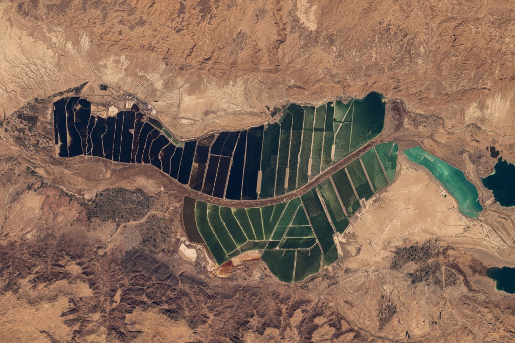 Salt evaporation ponds south of the Dead Sea in between Israel and Jordan are pictured from the International Space Station as it orbited 263 miles above the Middle East.