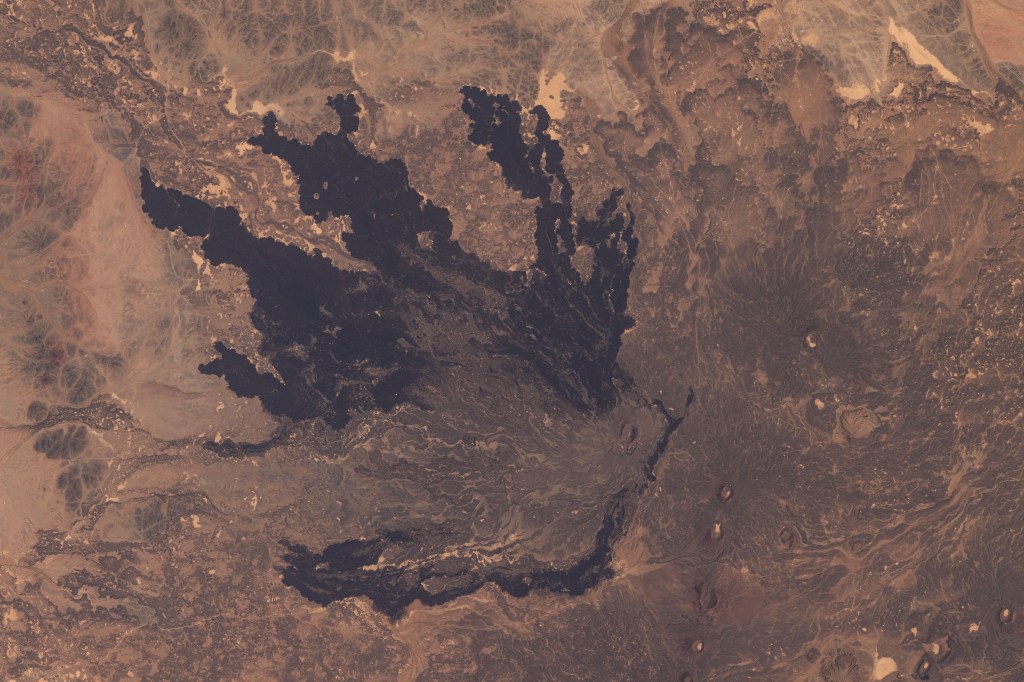 A lava field southeast of Medina, Saudi Arabia, is pictured from the International Space Station as it orbited 263 miles above the Arabian Peninsula.