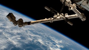 The 57.7-foot-long Canadarm2 robotic arm extends outward from the International Space Station as it orbited 264 miles above the Indian Ocean off the coast of the African nation of Somalia.
