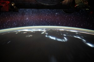 The International Space Station was orbiting on a northeast trajectory 254 miles above the African nation of Sudan when this long duration photograph was taken of the Middle East region. The night lights of civilization follow the Nile River, the atmospheric glow crowns Earth's horizon, and star trails from the vastness of space appear to rain on the planet's surface.
