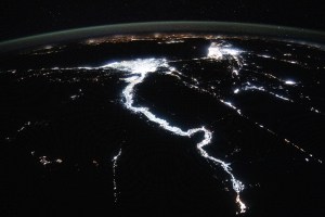 The night lights of civilization highlight the Nile River and dimly outline the shores of the Red Sea, the Gulf of Suez, and the Gulf of Adaba in the Middle East. The nations of Israel, Jordan, and Syria, as well as the Southern European region across the darkness of the Mediterranean Sea also are well lit in this photograph taken from the International Space Station at approximately midnight local time in Cairo, Egypt.