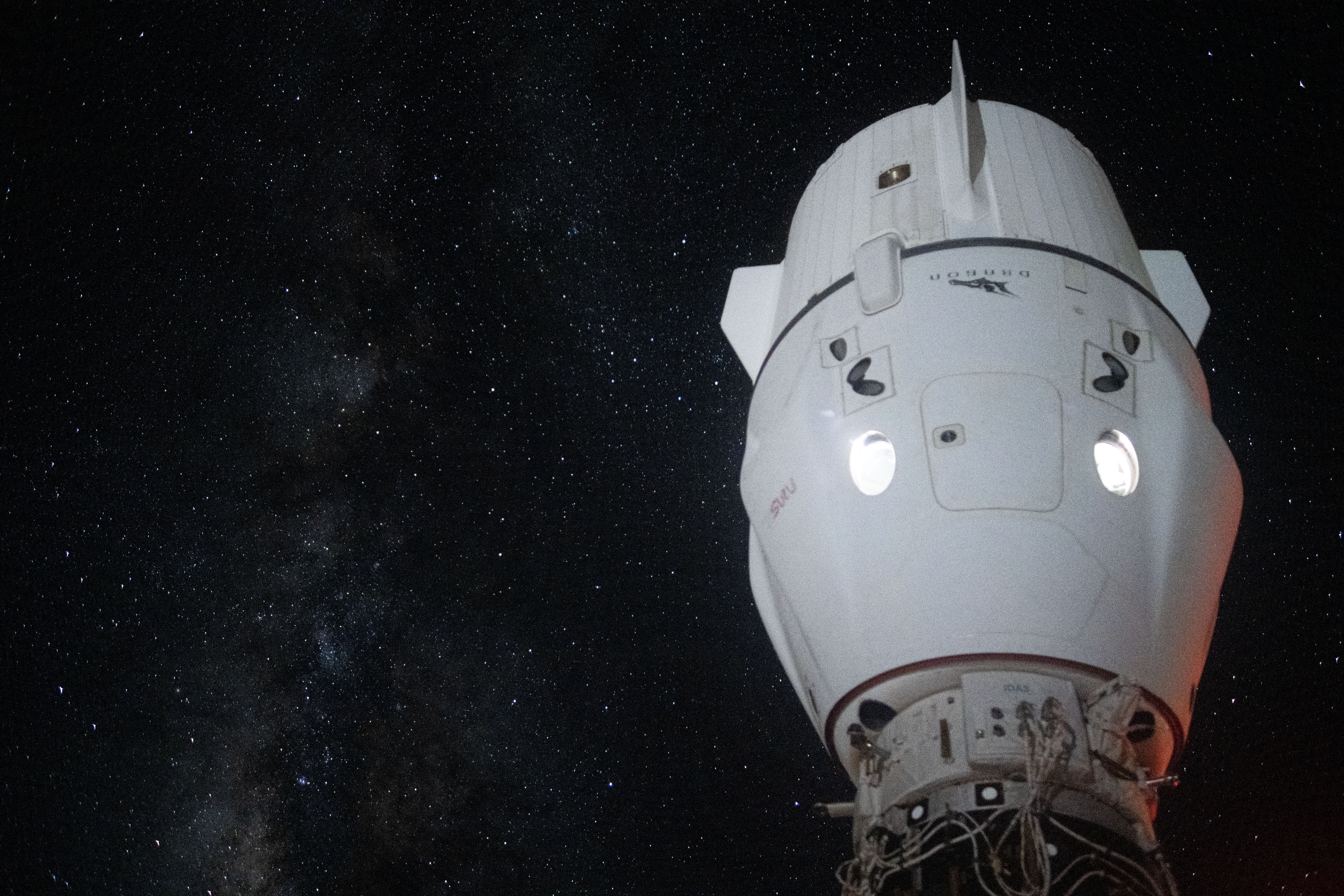 The Milky Way appears in the vastness of space behind the SpaceX Dragon Endeavour spacecraft docked to the Harmony module's space-facing port on the International Space Station.