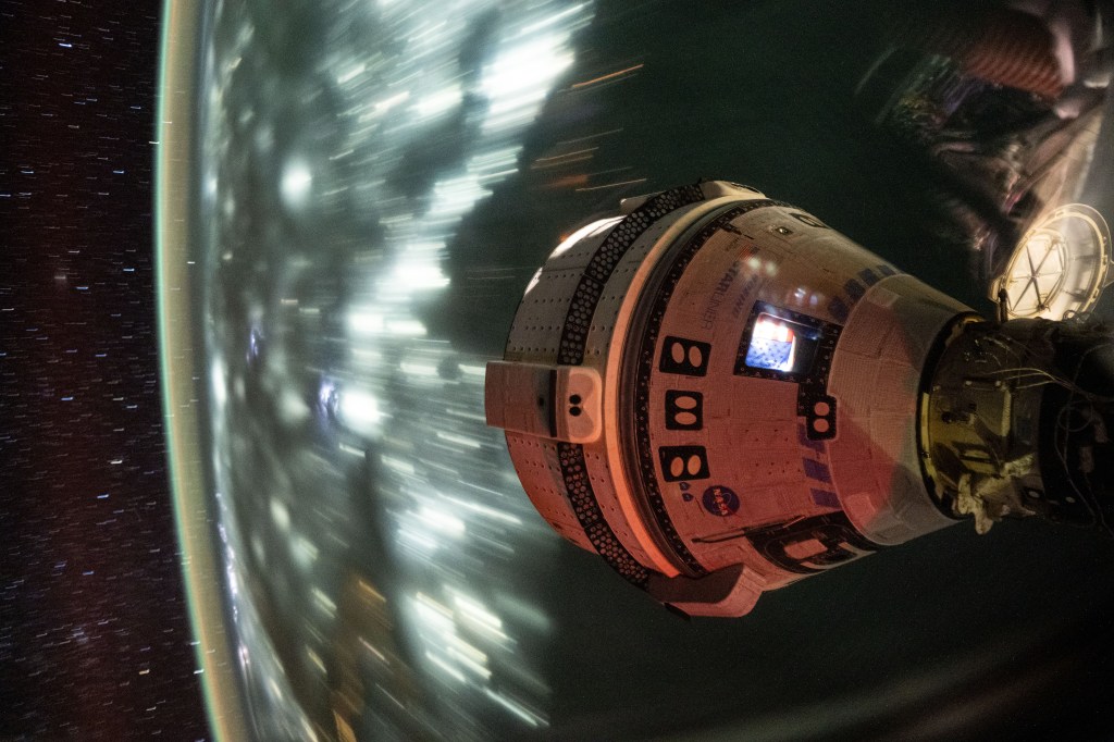 Boeing's Starliner spacecraft that launched NASA's Crew Flight Test astronauts Butch Wilmore and Suni Williams to the International Space Station is pictured docked to the Harmony module's forward port. This long-duration photograph was taken at night from the orbital complex as it soared 256 miles above the Arabian Sea off the coast of Mumbia, India.