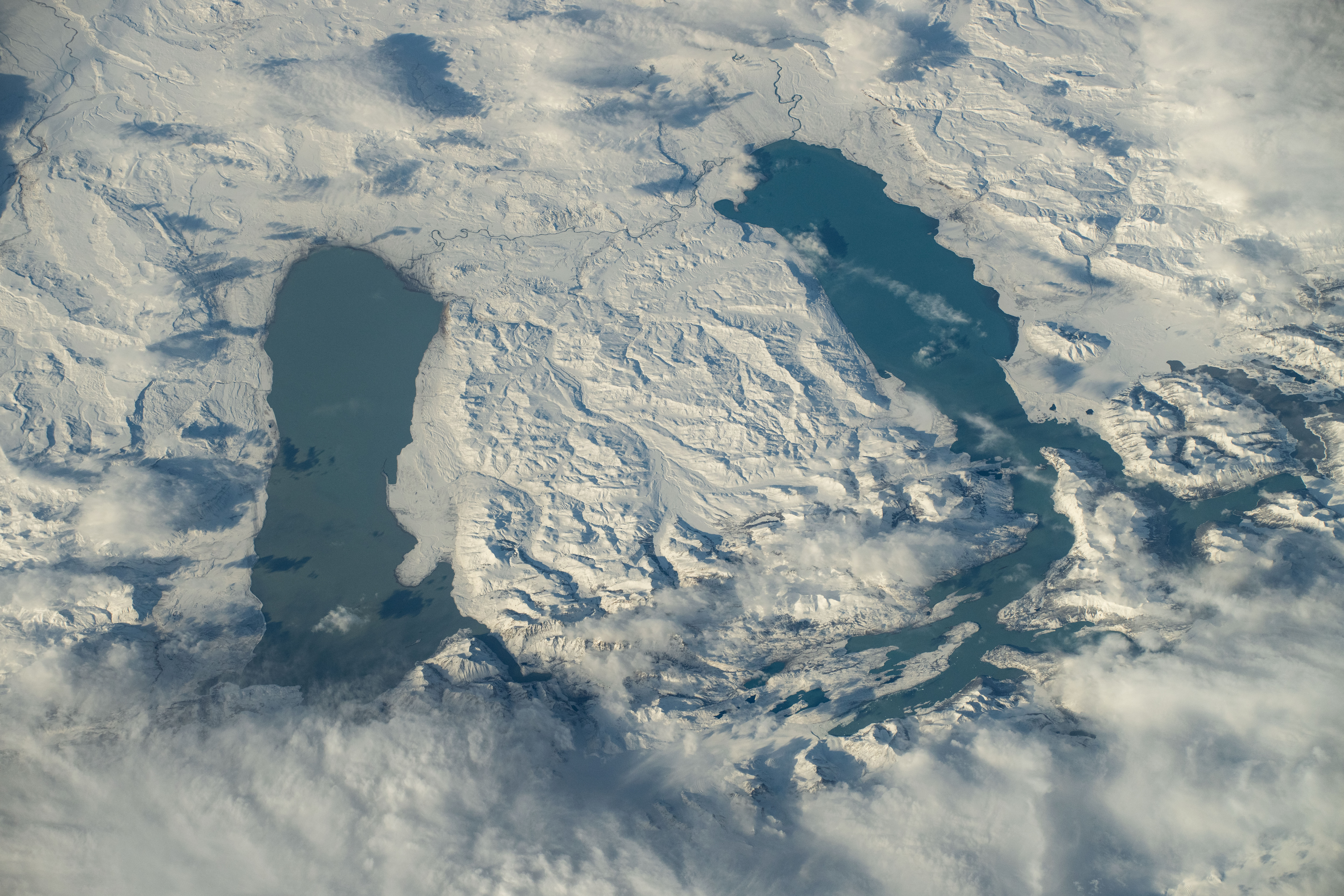 iss071e309961 (July 3, 2024) --In Southern Patagonia, two lakes run near parallel to one another, Viedma (left) and Argentino (right). The surrounding terrain is covered in snow around six months out of the year. Both lakes are fed by melting glacial ice by the nearby glaciers located in Los Glaciares National Park. As the International Space Station soared 272 miles above, NASA astronaut Butch Wilmore captured this photo.