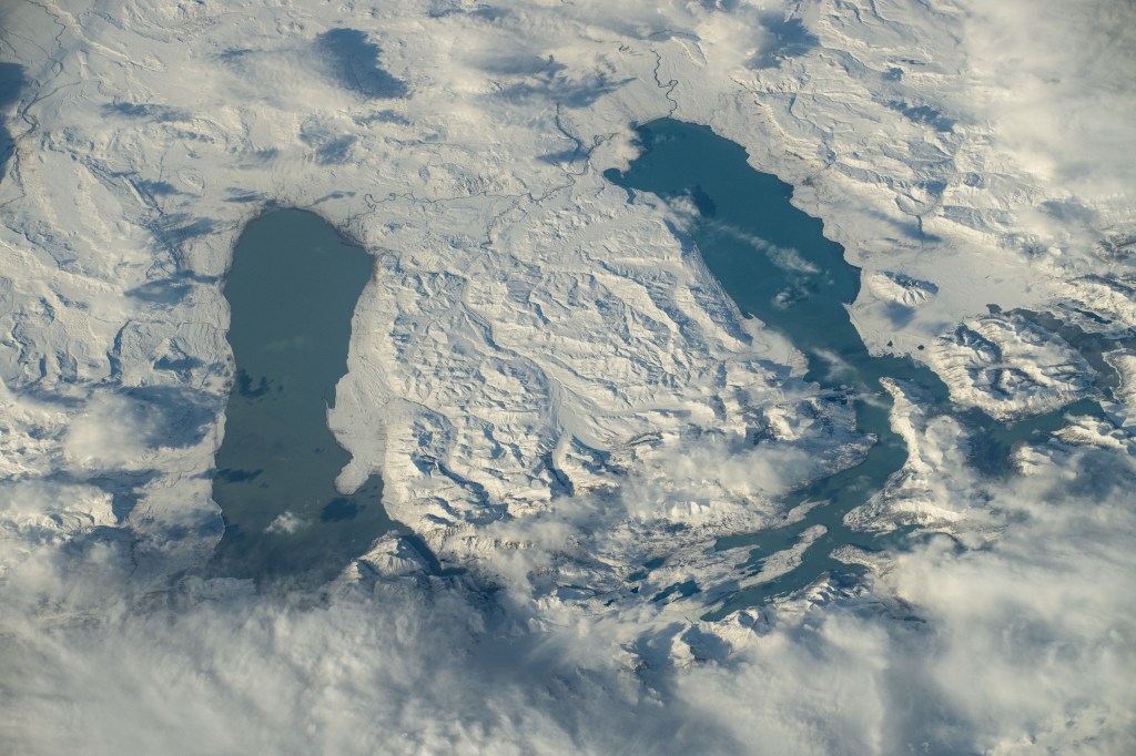 iss071e309961 (July 3, 2024) --In Southern Patagonia, two lakes run near parallel to one another, Viedma (left) and Argentino (right). The surrounding terrain is covered in snow around six months out of the year. Both lakes are fed by melting glacial ice by the nearby glaciers located in Los Glaciares National Park. As the International Space Station soared 272 miles above, NASA astronaut Butch Wilmore captured this photo.