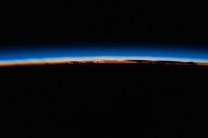 iss071e310017 (July 6, 2024) -- The last rays of an orbital sunset shine a striking orange against Earth's blue glow as the International Space Station orbited 255 miles above The Philippines.