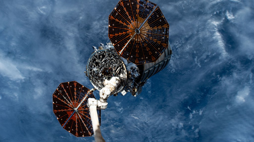 Northrop Grumman's Cygnus space freighter is attached to the leading end effector of the 57.7-foot-long Canadarm2 robotic arm about to be released into Earth orbit ending a five-and-a-half month cargo mission berthed to the International Space Station's Unity module.