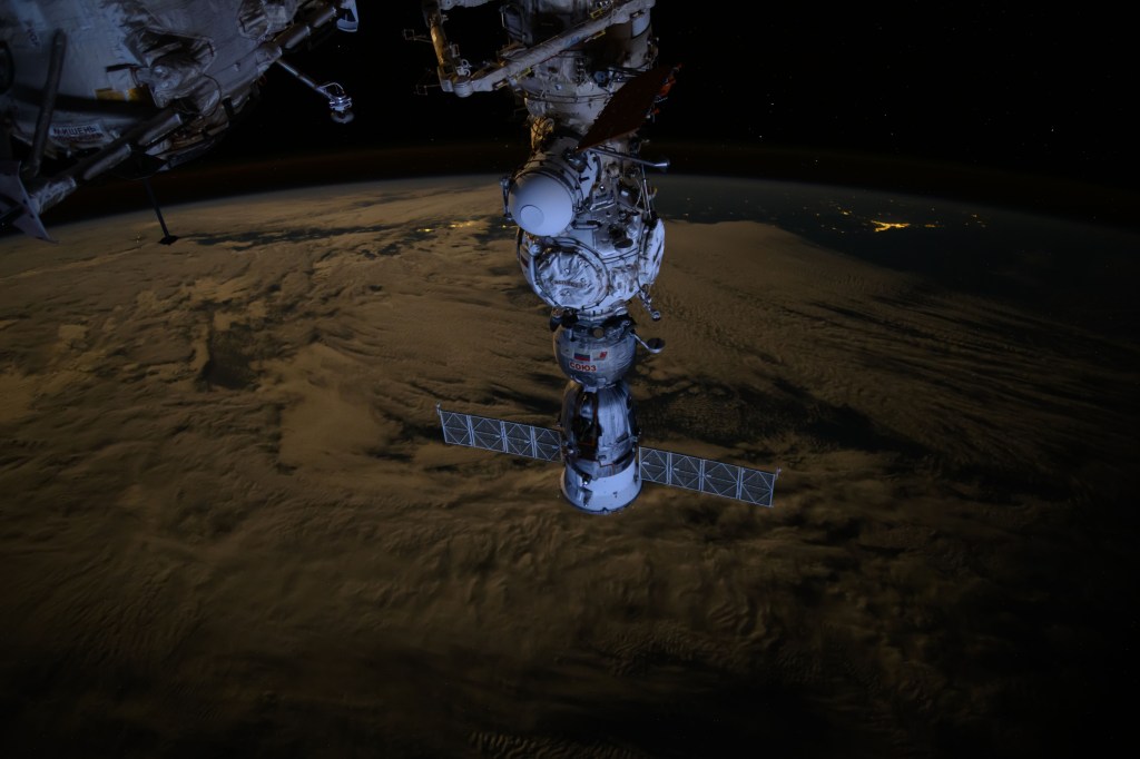 The Soyuz MS-25 crew ship is picture docked to the Prichal docking module as the International Space Station orbited 271 miles above the Tasman Sea off the coast of New Zealand.