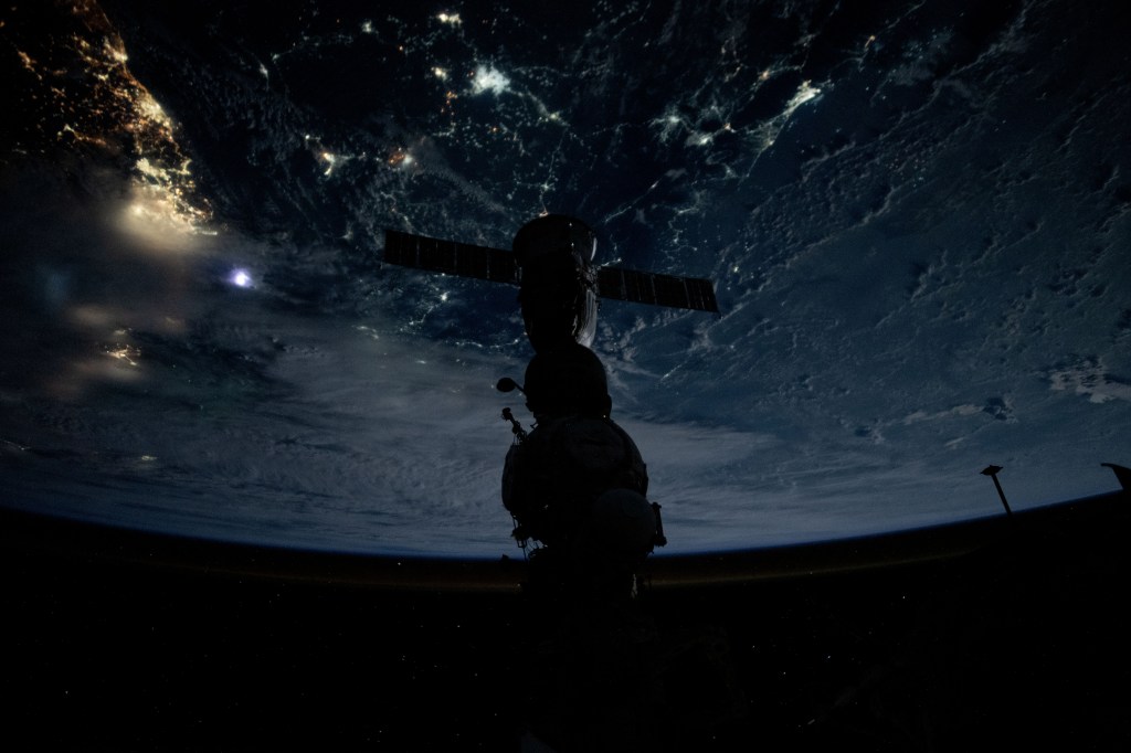 Silhouetted against the backdrop of the Earth below, is the Soyuz MS-25 crew ship docked to the Prichal docking module during an orbital nighttime pass. The International Space Station was soaring 261 miles above Jakarta on Indonesia's island of Java at the time of this photograph.