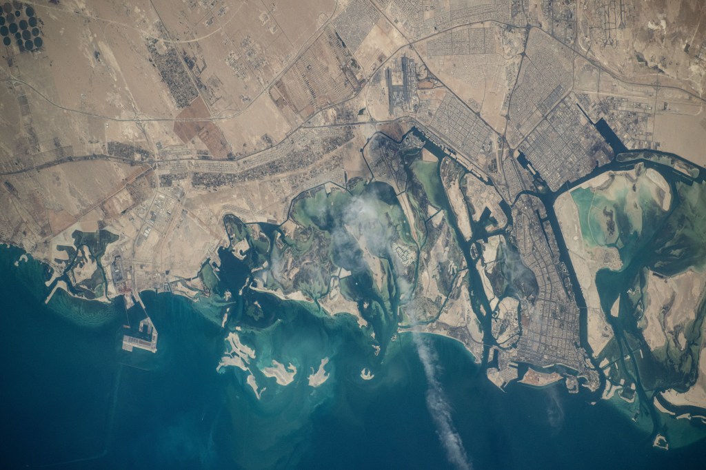 Abu Dhabi, the capital of the United Arab Emirates on the Persian Gulf coast, is pictured from the International Space Station as it soared 257 miles above the Middle East.