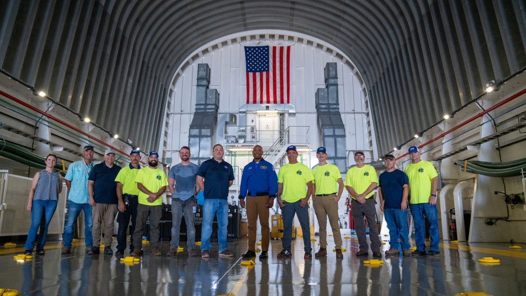 From left to right: Ashley Marlar, Jamie Crews, Nick Owen, Jeffery Whitehead, Scott Ledet, Jason Dickerson, John Campbell, NASA astronaut Victor Glover, Farid Sayah, Kelton Hutchinson, Terry Fitzgerald, Bryan Jones, and Joe Robinson.