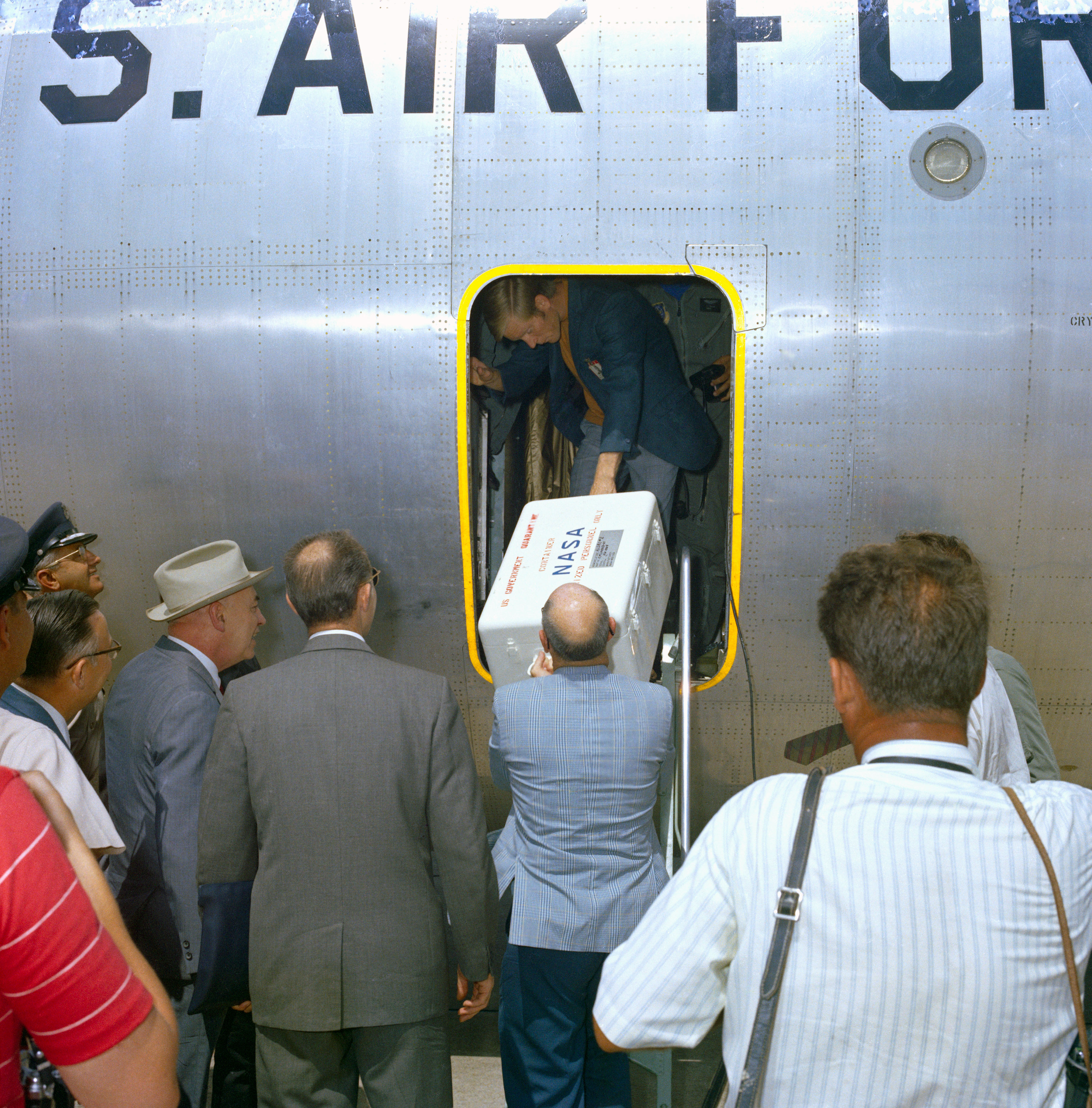 Workers at Houston’s Ellington Air Force Base unload the first box of Moon rocks about eight hours later