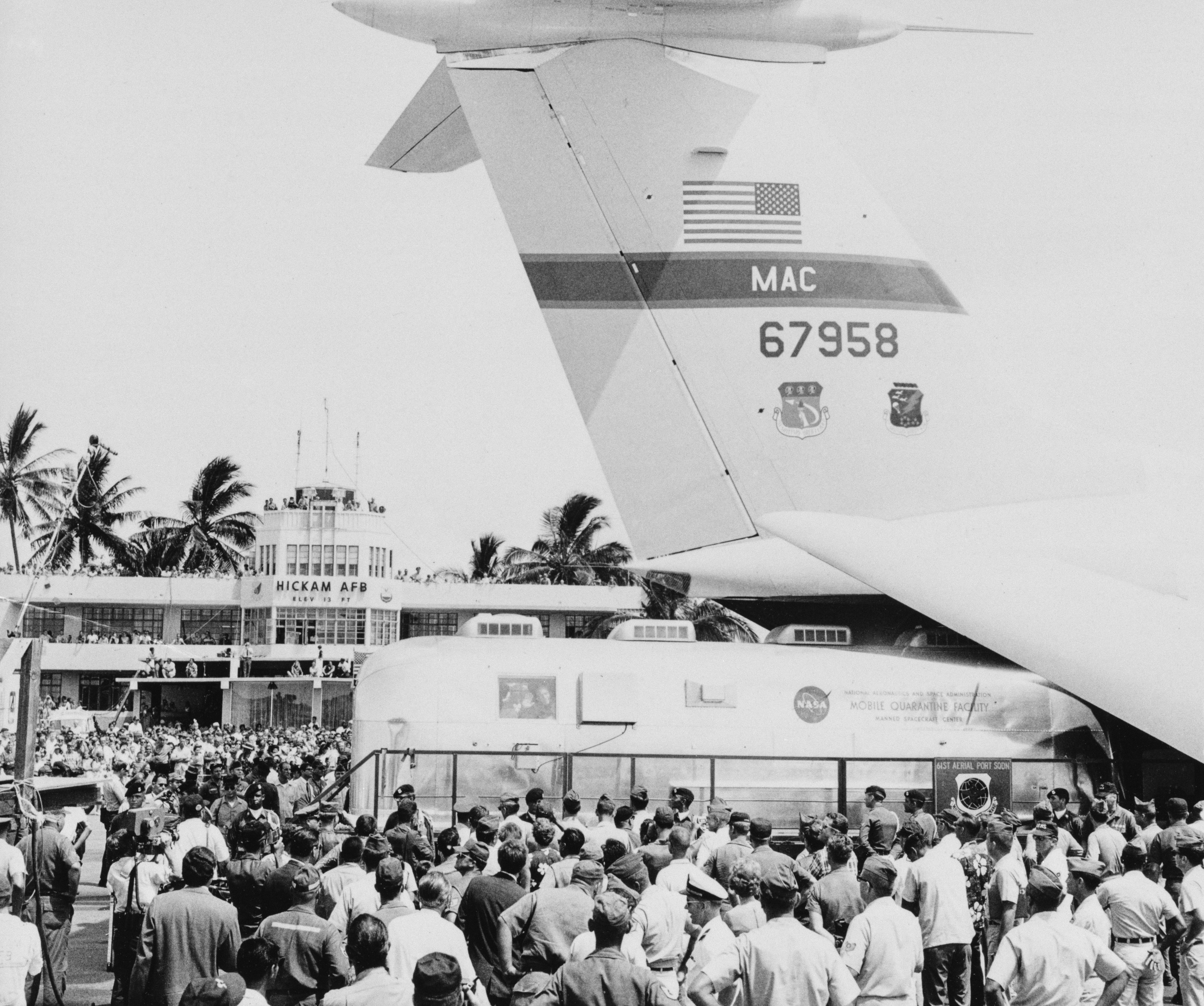 Workers load the MQF onto a cargo plane at Hickam for the flight to Houston