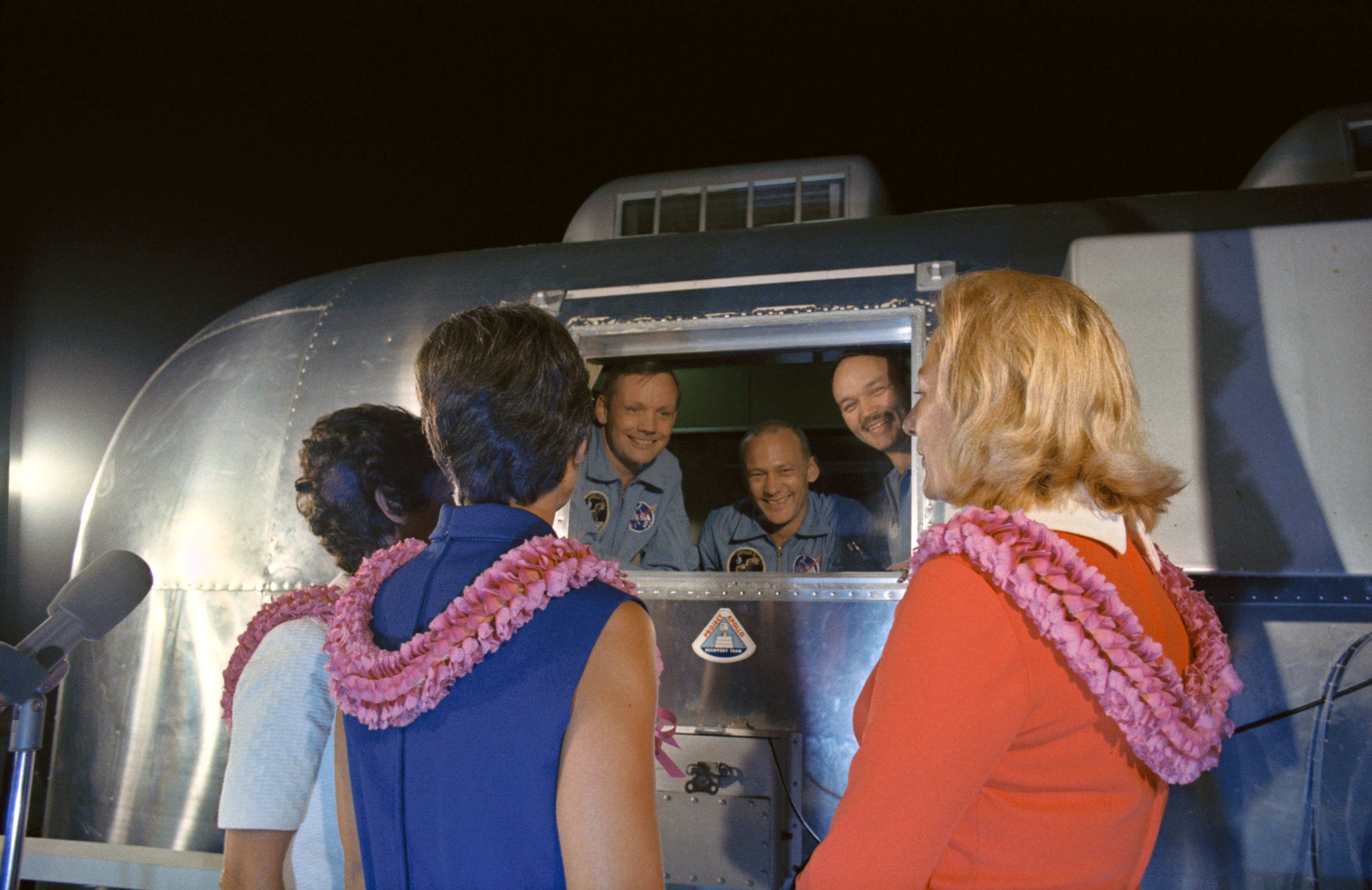 At Ellington, Neil, Mike, and Buzz reunite with their wives Jan, Pat, and TBS