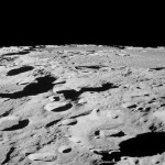 From lunar orbit, astronauts pointed cameras out the window of their spacecraft to capture photos of the moon's surface.